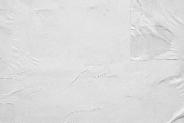 Fondo de textura de cartel de papel arrugado y arrugado blanco en blanco