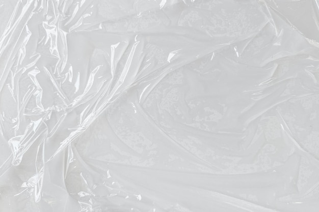 Fondo de textura de cartel de plástico arrugado y arrugado transparente blanco envoltura de plástico húmedo sobre el fondo blanco