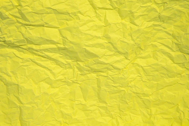 Fondo de textura de cerca de papel arrugado amarillo