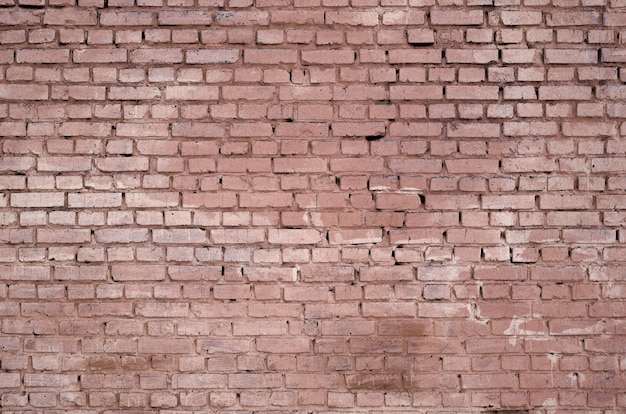 Fondo y textura cuadrados de la pared del bloque del ladrillo. Pintado en rojo