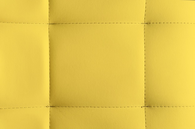 Fondo de textura de cuero amarillo fondo detallado de muebles de cuero o superficie de cuero sintético