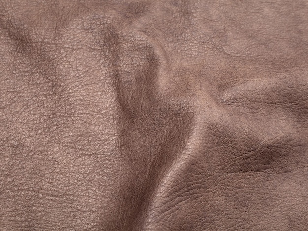 Fondo de textura de cuero de ganado marrón genuino. Foto macra