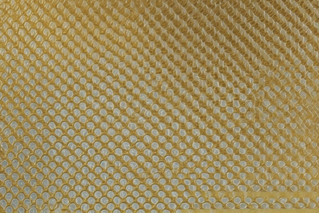 Fondo de textura dorada con color de malla de textura brillante y suave para diseño gráfico metálico