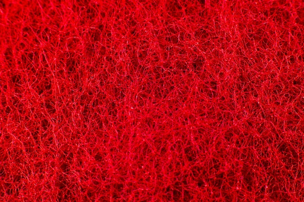 Fondo de textura de esponja roja. De cerca, foto macro.