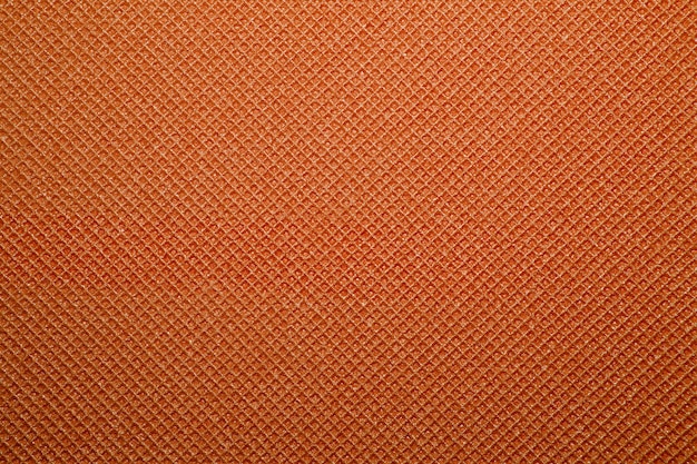 Foto fondo de textura de estera de yoga naranja.