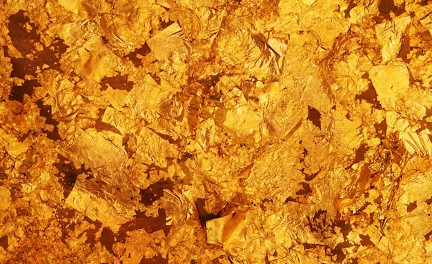 El fondo de textura de hoja de oro oscuro