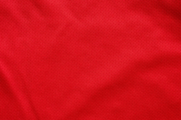 Fondo de textura de jersey de camiseta de fútbol de tela de ropa deportiva roja