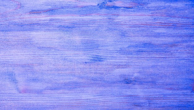 Fondo de textura de madera en color ultramar Tablero de madera violeta o morado muy peri