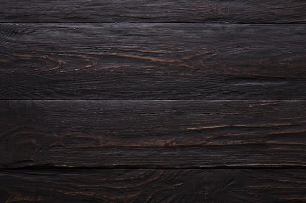 Fondo y textura de madera oscura. Superficie de madera rústica y vieja. Tablones de madera