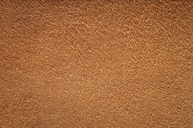 Fondo de textura de ante marrón Material de gamuza para bolsa de tela o zapatos Vista superior de primer plano