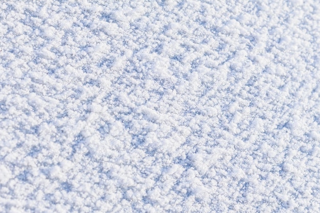 Fondo de textura de nieve fresca en tono azul espacio de copia de enfoque selectivo Textura de nieve fraccional