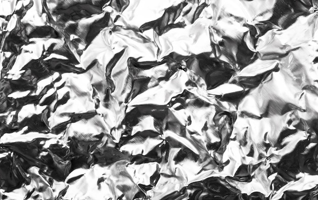 Foto fondo de textura de papel de aluminio plateado arrugado