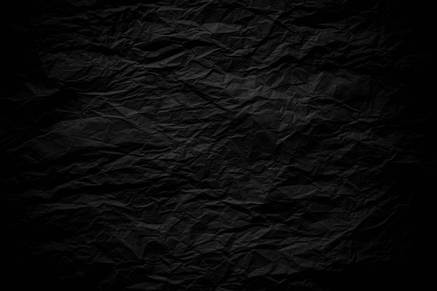 Fondo de textura de papel arrugado negro oscuro cerca