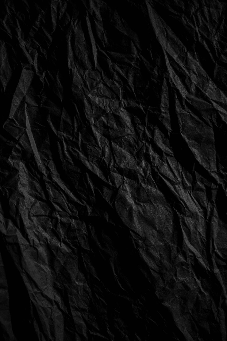 Foto fondo de textura de papel arrugado negro oscuro cerca