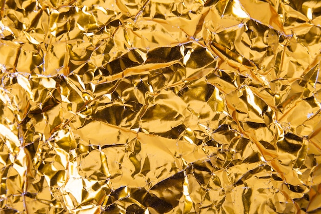 Foto fondo de textura de papel arrugado oro de la hoja.