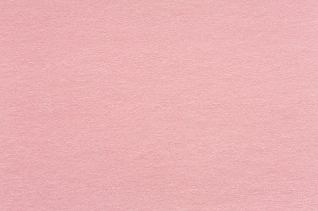 Foto fondo con textura de papel artesanal reciclado en rosa claro. tono de color rosa viejo: textura detallada de fibra de papel kraft reciclado en estilo en tonos pastel. textura de alta calidad en una resolución extremadamente alta.