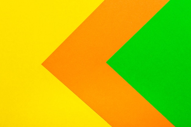 Foto fondo de textura de papel de color verde naranja y amarillo.