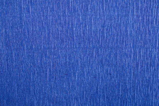 Fondo de textura de papel crepé en tonos azules de cerca