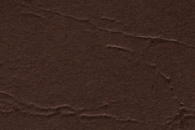 El fondo de textura de papel marrón oscuro se puede utilizar para las artes Foto de alta resolución