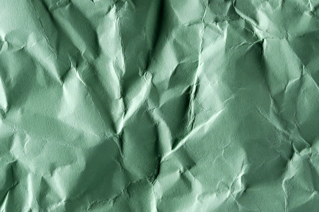 Fondo de textura de papel de papel verde arrugado de cerca la fotografía macro de alto detalle