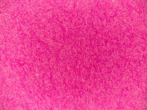 Foto un fondo de textura de papel rosa