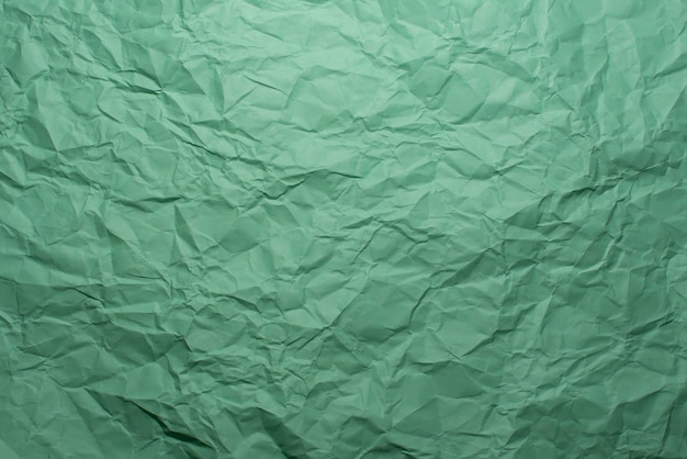 Fondo de textura de papel verde arrugado