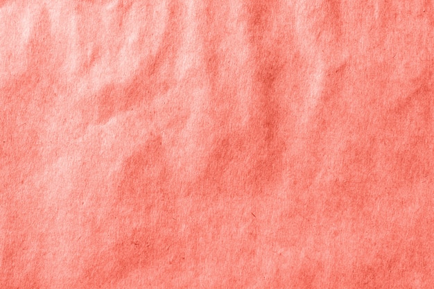 Fondo de textura de papel viejo. Imagen de tonos coral vivos.