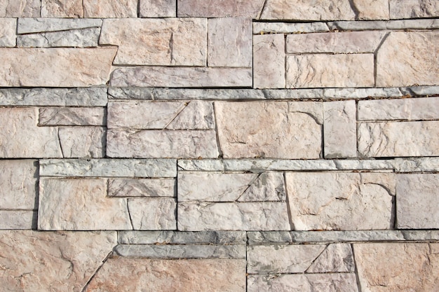 Foto fondo de textura de pared de bloque de mármol decorativo de varios tamaños.