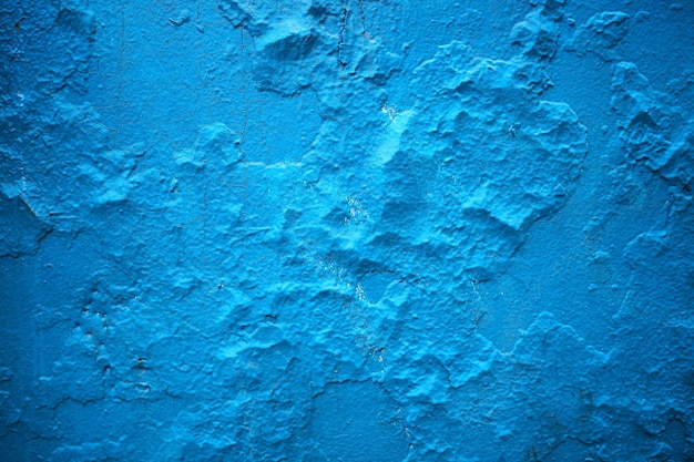 Fondo de textura de pared de calle agrietada azul