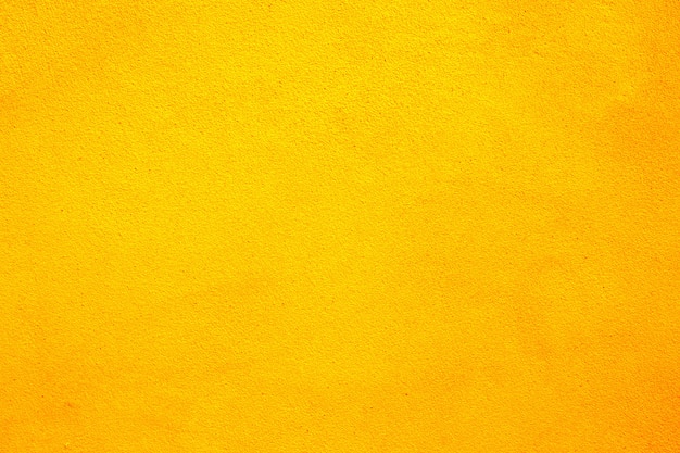 Foto fondo de textura de pared de cemento amarillo hermoso