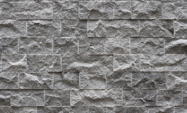 Fondo de la textura de la pared de la cerca de la albañilería del bloque del ladrillo de la piedra del diseño moderno