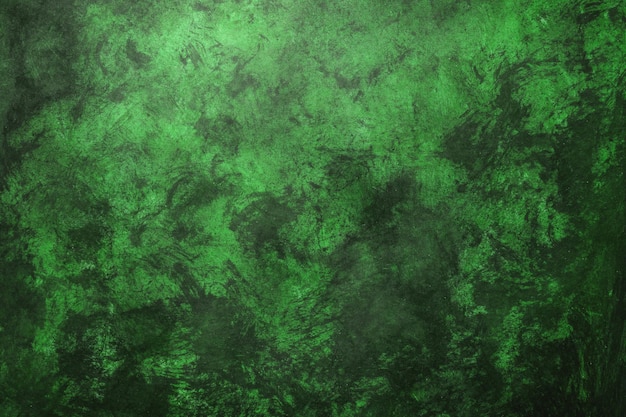 Foto fondo de textura de pared desgastada verde con tonos esmeralda