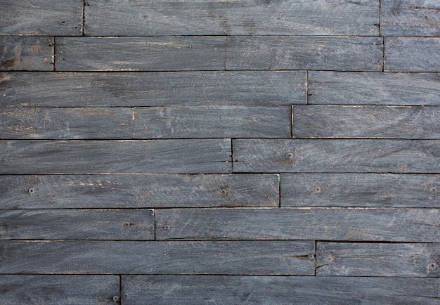 Fondo y textura de la pared de granero de madera negra decorativa