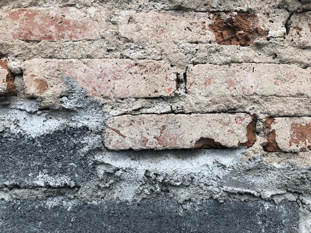 Fondo de textura de pared de grunge de hormigón de bloque de ladrillo antiguo. Pared de ladrillo vintage de cerca