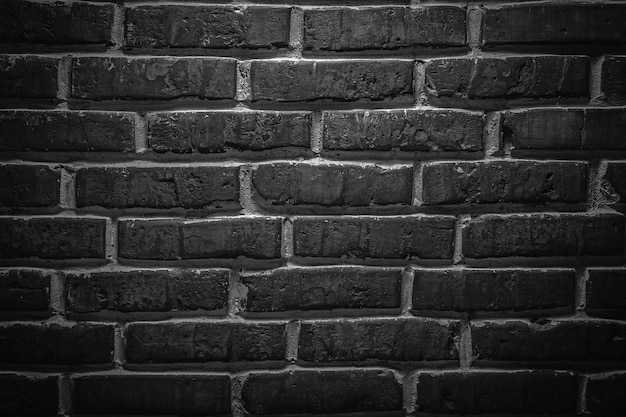 Fondo de textura de pared de ladrillo loft antiguo lijado negro o gris oscuro