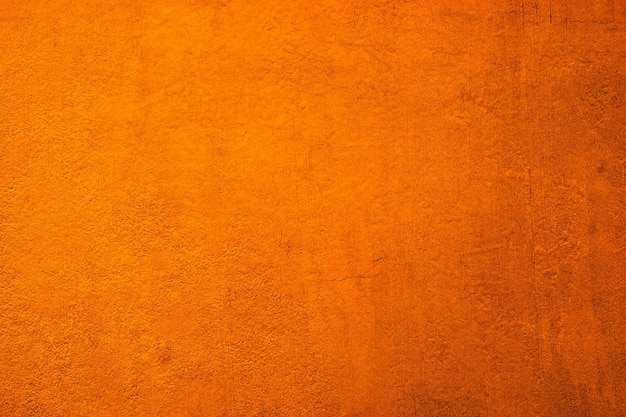 Fondo de textura de pared naranja grunge vertical hd