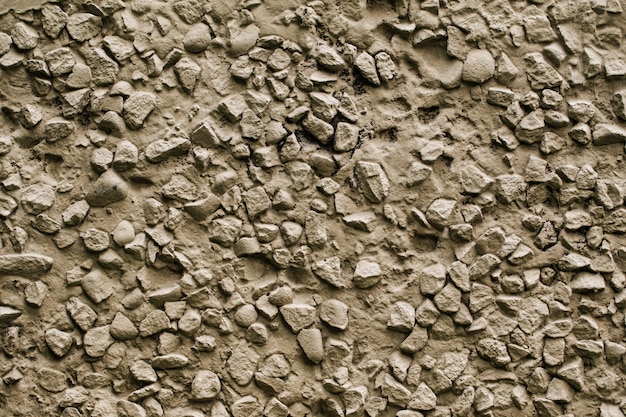 Fondo de textura de pared de piedra gris de fachada antigua