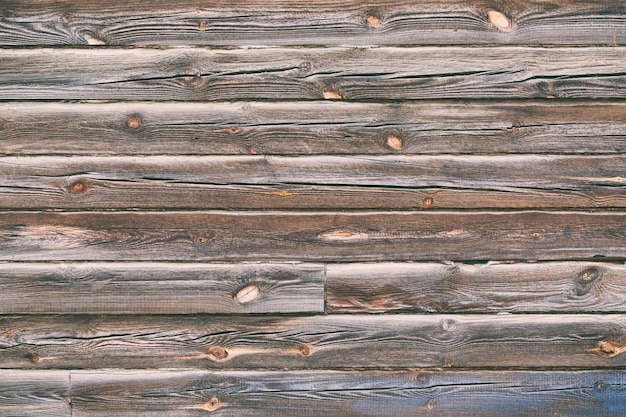 Fondo de textura de pared de tablones de madera marrón antiguo. Textura abstracta de detalle de arquitectura.