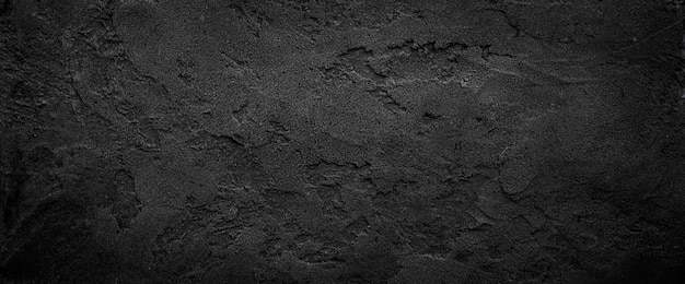 Fondo de textura de piedra granulada áspera gris oscuro o negro