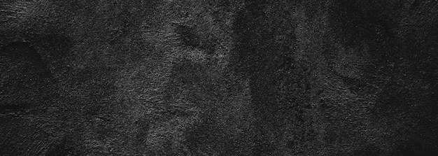 Fondo de textura de piedra granulada áspera de miedo o gris oscuro de pared negra Hormigón negro para fondo