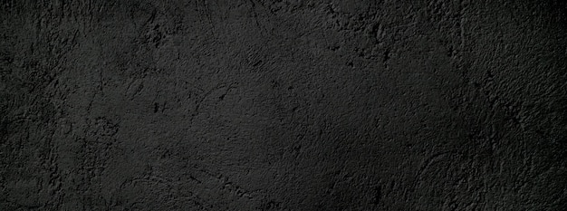 Fondo de textura de piedra granulada áspera de miedo o gris oscuro de pared negra Hormigón negro para fondo