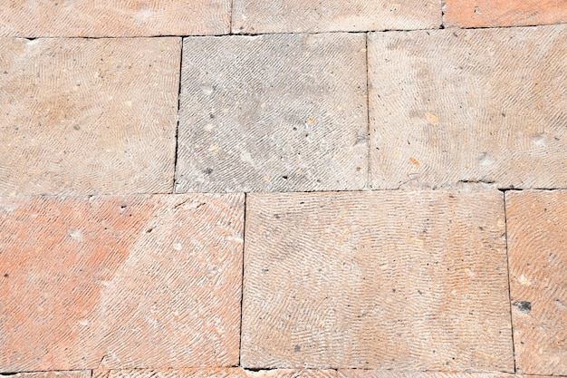 Fondo, textura de piedra. Muro de piedra tratada. Piedra con un patrón pequeño.