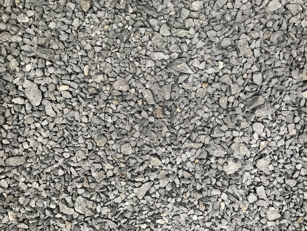 Fondo de textura de piedras pequeñas de guijarros de grava gris