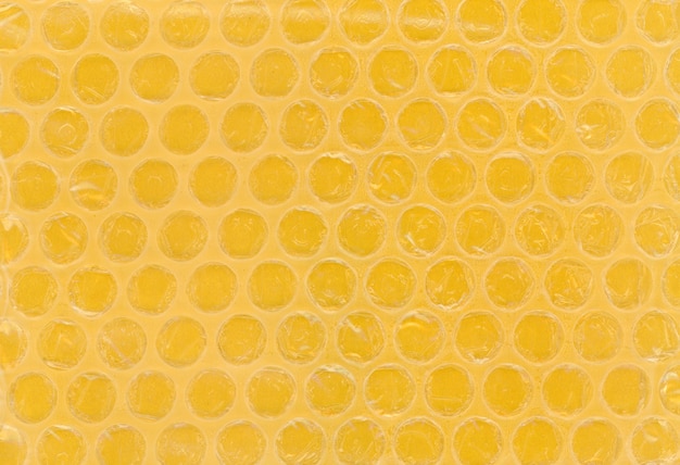 Fondo de textura de plástico de burbujas amarillo