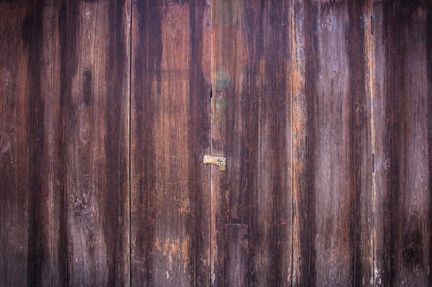 Foto fondo de textura de puerta de madera abstracta con viñeta