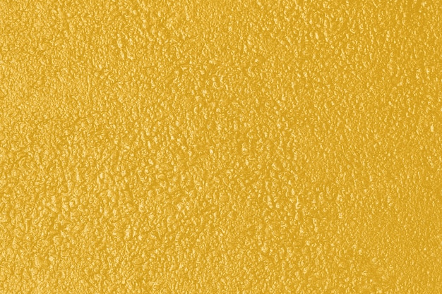 Fondo con textura rugosa en tonos de color amarillo.