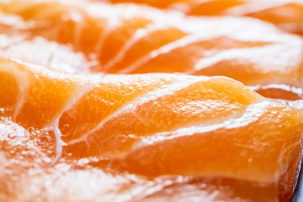 Fondo de textura de sashimi de rebanada de salmón fresco