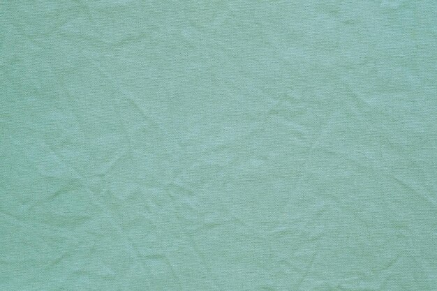 Fondo de textura de tela de algodón verde Tabla de tapiz textil de superficie arrugada
