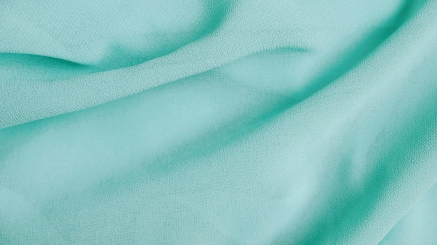 Fondo de textura de tela de gasa menta verde
