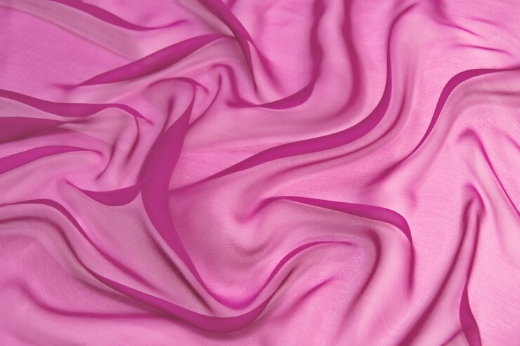 Foto fondo de textura de tela de gasa de seda de color rosa abstracto.